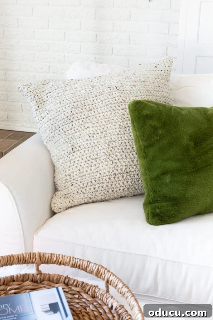 My Analog Carry: Intentional Essentials for an Offline Life 10 cream colored crocheted pillow on white sofa with a green pillow nearby