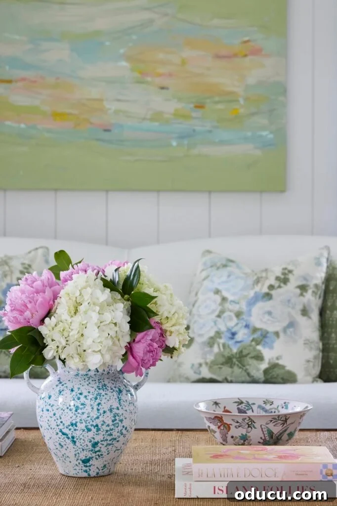pretty vase of flowers on a table in a room filled with spring colors.