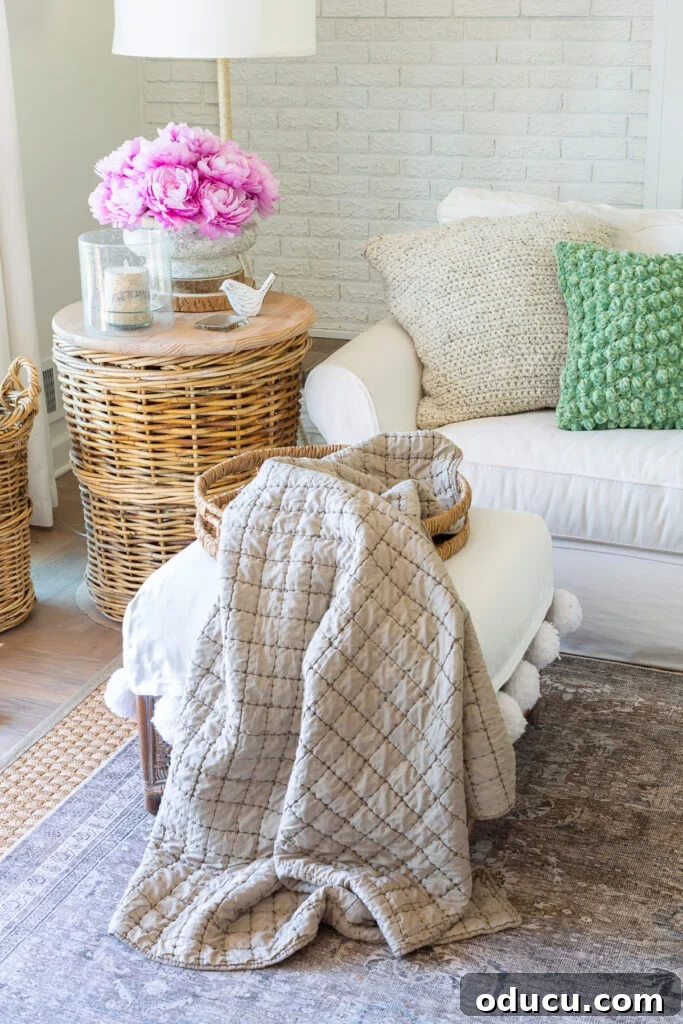 Early spring decor in living room using faux pink peonies and light green accent