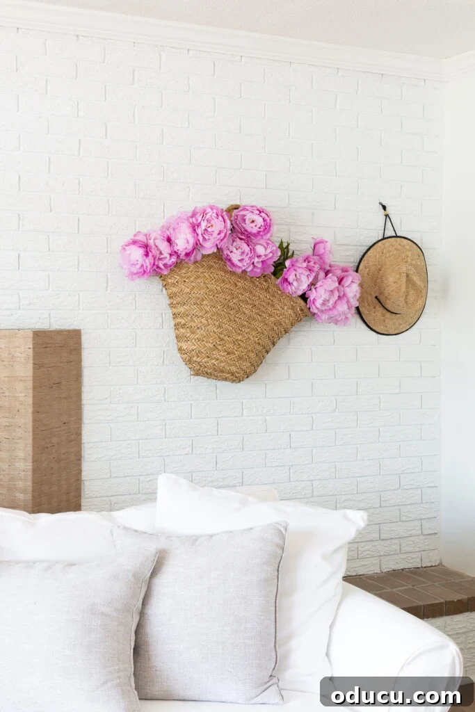 Flowers in a basket hung on a wall for simple summer decorating
