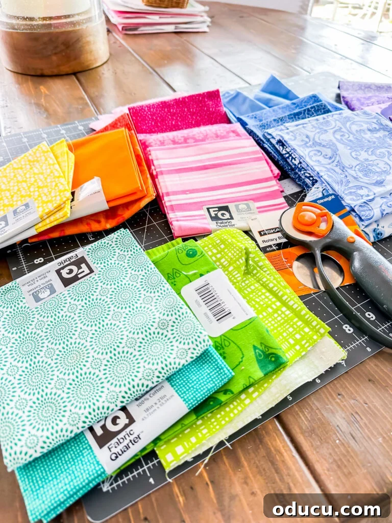 Pile of Fabric scraps and quilt fabric quarters