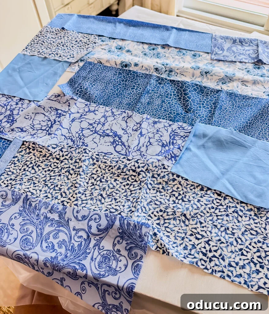 Cut out fabric strips being attached to a white painted canvas with Mod Podge.