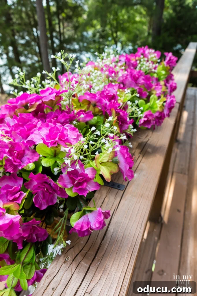 Filling window boxes with artificial flowers.